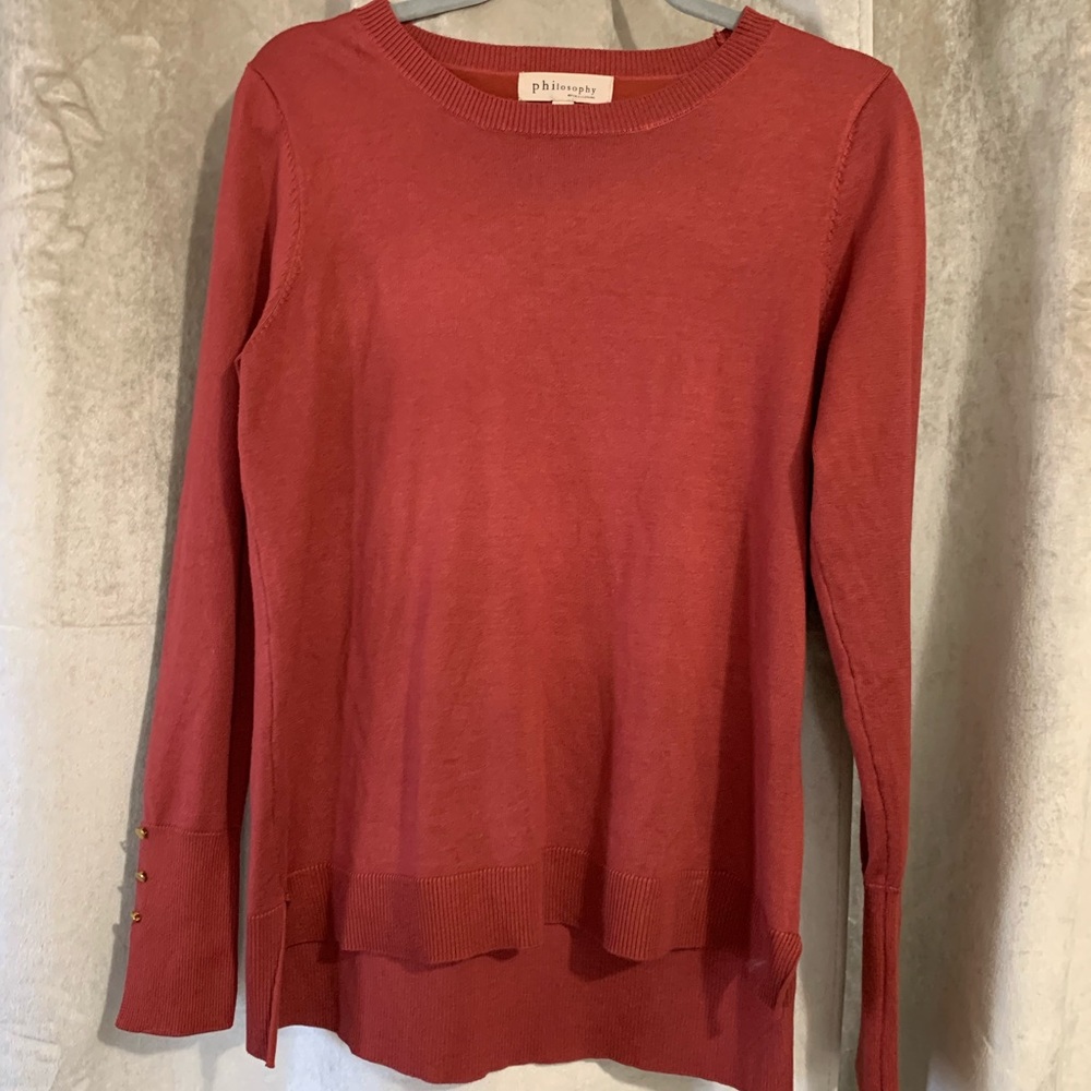 Philosophy sweater in red with gold buttons at the sleeve
